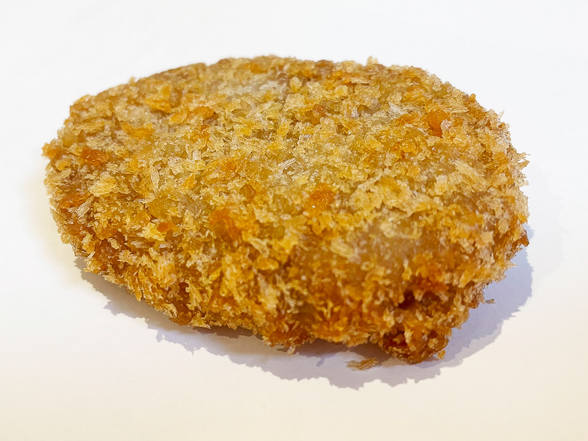 『丸長精肉店』の「コロッケ」(80円)